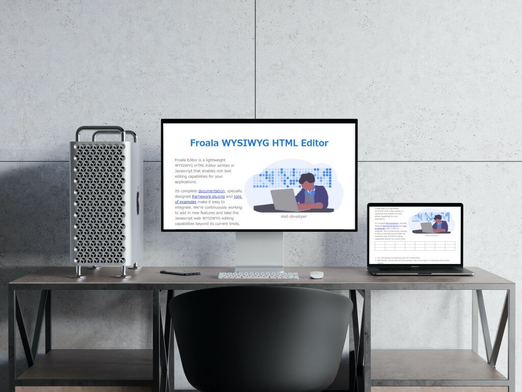 A modern workspace with a large screen showing Froala's WYSIWYG HTML editor and a laptop.